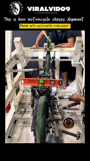 viral vid on Instagram: "A single misaligned degree can completely change how a motorcycle rides, handles, and wears over time. This process uses laser-guided reference lines, fixed jigs, and mechanical leverage to bring the frame, swingarm, and rear wheel back into perfect alignment. The green laser acts as a true centerline, revealing distortions invisible to the naked eye. Instead of replacing parts, technicians apply controlled force to realign the chassis itself, restoring factory geometry