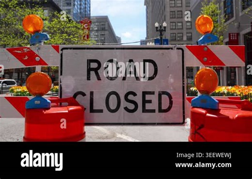 Blocked road with barricades and warning sign ROAD CLOSED showing restricted access and construction area in the city. Wide view Close up. High quality 4k footage Stock Video Footage - Alamy