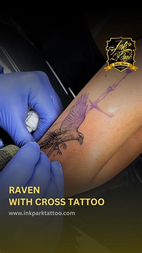 Black and Grey Fine Line Realism Raven with Cross Tattoo This tattoo features a raven in flight, clutching or positioned near a cross. The raven often symbolizes mystery, transformation, and intelligence, while the cross stands for faith, sacrifice, and spiritual strength. The piece is done in black and grey shading with fine line detailing, creating a clean, realistic, and meaningful design. #RavenCrossTattoo #BlackAndGreyTattoo #FineLineTattoo #BestTattooStudioInBangladesh #BestTattooStudioInD