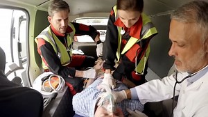 Paramedic using an external defibrillator during cardiopulmonary resuscitation Free Stock Video Footage