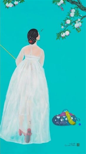 A beautiful Korean lady in traditional hanbok shows off her perfect golf swing