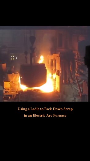 Using a Ladle to Pack Down Scrap in an Electric Arc Furnace #steelfactory #steelmill #foundry #millwright #steel #molten #iron