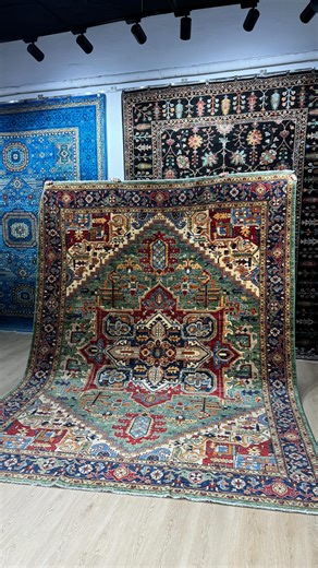 A masterpiece of tradition and strength 🤍 This Green Heriz carpet is a true statement of heritage, craftsmanship, and timeless beauty. 🧵 Fully handmade in Afghanistan, this carpet features the iconic Heriz geometric design, known for its bold medallion, powerful patterns, and exceptional durability. The rich green field, balanced with deep reds, ivory, and earthy tones, creates a striking yet elegant presence—perfect for spacious living rooms or master bedrooms. 📐 Size: 2.7 × 3.6 m | 9 × 12 f