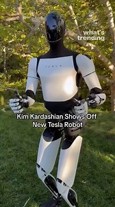 Kim Kardashian shared a video on X (formerly Twitter) showing off her new Tesla robot, captioning it, "meet my new friend." The Tesla Gen 2 humanoid robot, also known as Optimus, is expected to enter full production by 2026, with a potential price range of $20,000 to $30,000, though they may be used internally by Tesla as early as next year. Credit: Kim Kardashian #Tesla #Optimus #KimKardashian | What's Trending