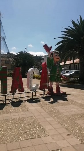 Festive Inflatable Santa Claus Display in Sunny Setting