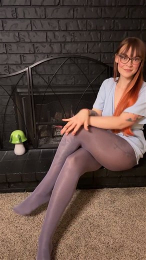 Liv on Instagram: "Streaming on Twitch right now! Layering lavender @misso.lingerie over coca @wolford Neon 40s too! #tights #layers #layering #ootd #fashion #redhead #glasses #legs"