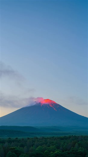 Experience the awe-inspiring power of nature in this captivating footage, as we witness a distant volcano nestled within a lush forest. Its majestic peak is enveloped in delicate smoky tendrils, creating a scene of quiet, untamed beauty. Suddenly, the tranquility is shattered by an explosive eruption, showcasing the sublime and unpredictable might of our planet. This video was created on Syllaby, click here to make your own: https://syllaby.io/?via=ryan53! | Summit Videos