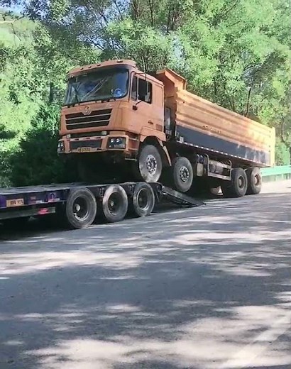 Loading Dump Truck on Low Bed Trailer - Heavy Equipment Transport