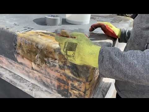 Repairing a water tank using a fibreglass repair kit