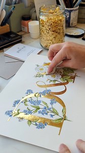 15K views · 3.6K reactions | A love letter in gouache and gold leaf. The story behind this brought a tear to my eye and put any problems in my life into perspective. It's not my story to share, but I'm honoured to be trusted to create something so precious. I always pour love into my creations, but I squeezed every ounce I had into this. #botanicalart #goldleaf #bespokepainting | Theodora Gould Designs | Facebook