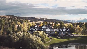 In the Southwest corner of Montana, in the heart of the Bitterroot Valley is where you will find the exclusive Stock Farm Club. Within this private community, nestled on a stunning 17-acre estate you will find the ultimate Western Farmhouse. This property is complete with a breathtaking 25,000 square foot home, 4-stall horse barn, pond, and artisan creek. The 10-bedroom main home features a grand main living area, multiple private guest quarters, and unique features, including a grotto style poo