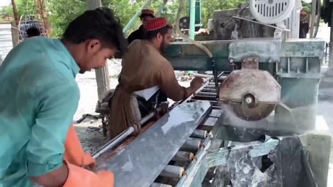 Skilled Workers Transform Cloudy Stone Into Tiles