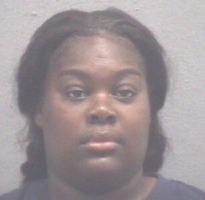 Woman charged with open murder in shooting of Muskegon woman