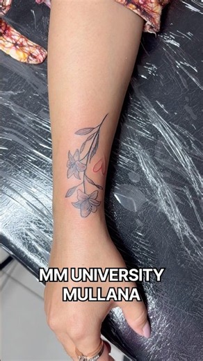 Small flower design tattoo