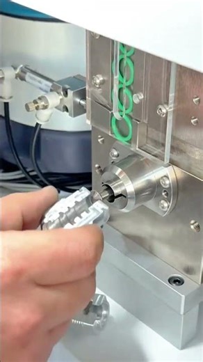 Automated Machine Precisely Installing Green O Rings into Precision Metal Components