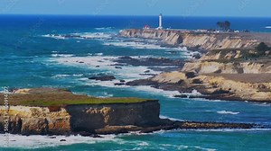 Point Arena Lighthouse Racas Sea Lion Rocks Cove California aerial drone Stornetta coastal Trail Mendocino coast scenic vista point sunny daytime morning afternoon blue sky waves nature circle right