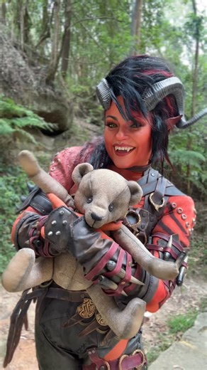 Eva Devore on Instagram: "It’s Clive! 🐻🧸 I made a Clive bear for a recent photoshoot and I’m so chuffed with how it turned out. A super fun and quick make! Did you know that Clive was named for the author of The Hellbound Heart, Clive Barker? Did you notice Karlach’s teddy in her camp in BG3? 🧸 #karlach #bg3 #baldursgate3 #karlachcosplay"