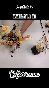 1K views · 18 reactions | Get ready for a spooktacular centerpiece that’s sweet, quirky, and creatively fun! Our Halloween Candy Machine Arrangement combines playful candy-themed stems, marshmallow ball accents, and bold ribbon loops to bring a touch of whimsical fright to any table. Ready to make your own eye-catching candy machine magic? Start designing here: https://www.keleas.com/product/halloween-candy-machine-arrangement-supply-list/ | Kelea's | Facebook