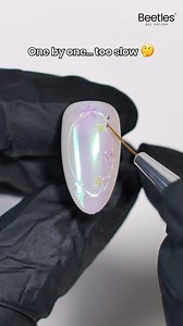 974K views · 13K reactions | Nail Hack: Faster Way to Apply Beads ✨ One by one? Too slow 樂 Try this magnet trick for perfect bead placement in seconds! ⚡ #beetlesgelpolish #nailhack #nailtutorial #naillover #nailartideas #nailsofinstagram #nailtips #naildesigns #nailinspo | BeetlesGelPolish | Facebook