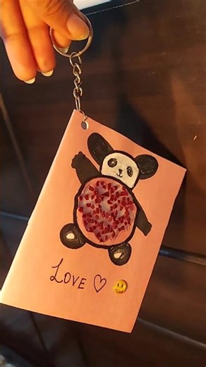 Close-up panda face with sparkly sprinkles + text "DIY Keychain #cutepanda #babypanda #diydiary #yt