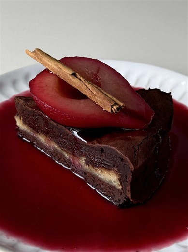 poached red wine bosc pear, fudgy flourless marzipan dark chocolate torte ♣️🍷 my favourite chocolate torte recipe! such a rich and delicious dessert!! I will be sharing the recipe on my website (hopefully in the next few months) 🖤