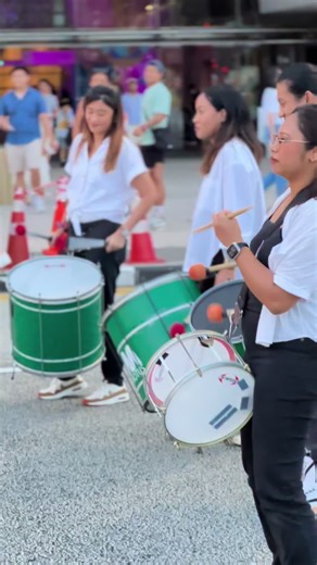 Engaging Street Performance with Vibrant Drumming