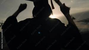 Rear view of Graduation Congratulations student ceremony on the day of graduation at the university,Sunset Silhouette orange sky Slow motion 4K