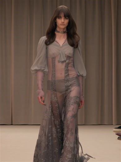 McQueen Autumn Winter 2026 – Aliana in look 34. A dress in silver silk georgette with metallic floral lace embroidery. Koko sandals in lilac satin. Video: InDigital Music: A. G. Cook Styling: Camille Bidault Waddington Casting: Julia Lange Hair: Anthony Turner Make-up: Daniel Sallstrom Nails: Ama Quashie Concept & Production Design: Tom Scutt Production: La Mode En Images Lighting Director: Raiden Studios Movement: Ryan Chappell