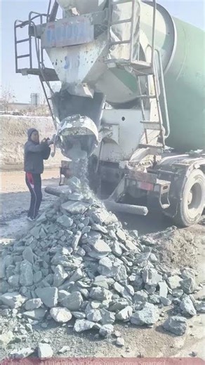 Live Cement Mixer Truck Unloading Scene, Worker Manually Clearing Stone Pile