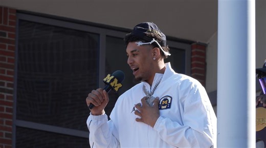 Michigan fans gather outside basketball arena in Ann Arbor to welcome the 2026 national champs home