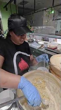 Italian Pasta in a Roman Pecorino Cheese Wheel. Street Food