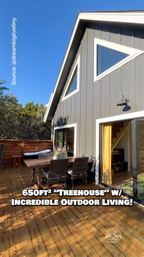Would you live in this 650-sqft jungle-themed "treehouse" built on stilts with an incredible outdoor living setup? Comment TREEHOUSE & I'll message you the full video tour! Inside, this small home features a spacious floor plan with a living room, a kitchen with full-size appliances, a main-floor bedroom with a full-size closet, a beautiful bathroom with a tile shower & soaking tub, as well as an additional loft space that serves as a guest bedroom or an office! The best part in my opinion is th