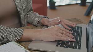 Woman working on a computer in an office - Free Stock Video