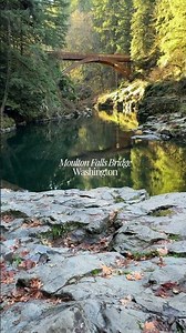 The historic Moulton Falls Bridge over a teal-colored Lewis River