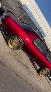 Candy red Cutlass on gold 26’s Forgios in the lab at JugHead’s