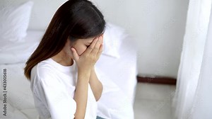 Psychologist touches a depressed Asian woman for encouragement. Woman crying and then friend's hand came to her shoulder to comfort and encourage. Stock Video