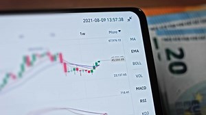 Euro Banknotes and Bitcoin cryptocurrency investing concept. Euro Money and Crypto currency golden bitcoin coin.