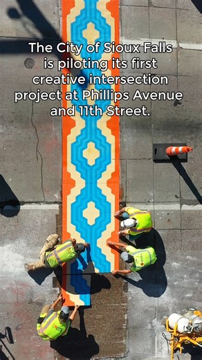 Bold Art. Safer Streets. Downtown Sioux Falls is getting a colorful upgrade! The Intersections Project is transforming crosswalks at 11th and Phillips into vibrant public art. Local artist Cam Abbas designed three themes inspired by belonging. "My designs revolve around the concept of belonging. Sioux Falls is a home to all types of people, so everyone should feel welcomed," says Cam. "The concept of sharing a space is reflected by having each design embody bold patterns that reflect home rug de