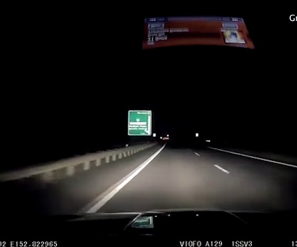 Driver cheats death as hoon drops concrete from bridge