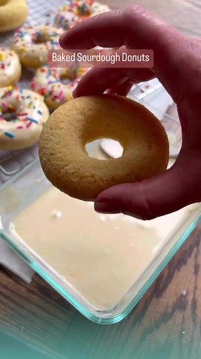 Baked Sourdough Donuts 🍩 Instructions: Preheat the oven to 350. Next, grease your donut pan. Melt the butter and set aside. Stir together flour, sugar, salt, and baking powder in a large bowl. In a separate medium bowl, mix together melted butter, egg, sourdough starter and water. Pour the wet ingredients into the dry ingredients and stir until just combined. Be careful not to over mix. Scoop the batter into a piping bag or zip-lock bag and clip the corner about 1/4-1/2 inch wide. Squeeze the b