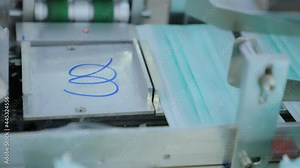 Mask factory a small business Sewing machines are make production for general people public and medical personnel. Production line with automatic machines to prevent dirt from contaminating product.