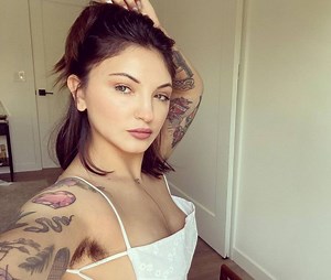 Pit crew: Singer Julia Michaels poses with armpit hair proudly on display