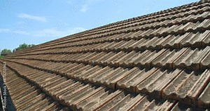 Shingles texture roof of old industrial building. Industrial area with old buildings