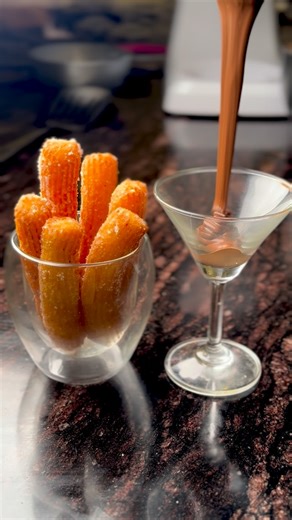 Yuvraj Dewan on Instagram: "The best recipe for the best eggless churros! Exactly like the cafe ones. Crisp on the outside and soft on the inside. Melts in your mouth with each bite. Only takes 4 ingredients to make these churros. Butter sugar water and flour. That’s it! Full recipe pinned in the comments. Happy baking! ✨ . . . . . #churros #eggless #egglesschurros #fyp #recipe #chocolate #hotchocolate #explore #yuvrajdewan #chefyuvrajdewan #viralreel #chef"
