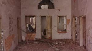 Beirut, Lebanon, 2020: day drone shot track back of the inside of a destroyed house from the balcony due to the 4 August explosion
