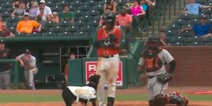 An MiLB player put his bat down during a plate appearance, so the bat dog tried to take it from him