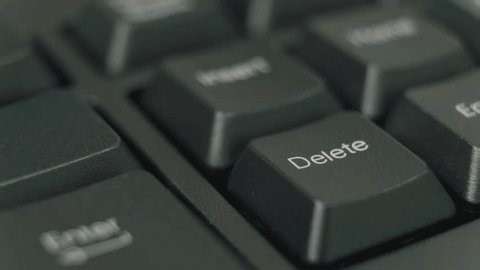 clip-3998343065-close-up-finger-pressing-delete-key-on-keyboard