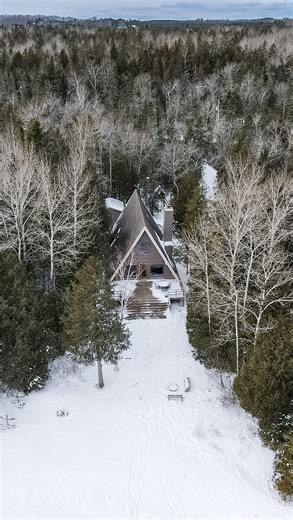 Waterfront Cabins | Door County, WI | Hosts: Jeremy + Caitlyn on Instagram: "A-frame. Fireplace. Snow falling outside. This is winter at its best. Comment WINTER STAYS for availability + booking link."