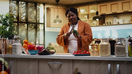 Food blogger filming step by step avocado cutting tutorial indoors, woman content creator demonstrating meal prep and recipe preparation on a cutting board. Rich in proteins avocado on toast.