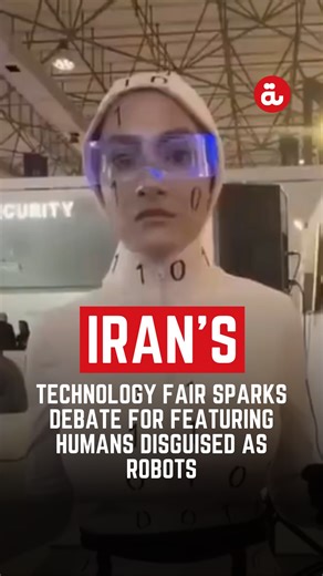 #watch: Iran's technology fair, the 2025 "Kish Inox Tech Expo" recently raised questions for featuring humans disguised as robots rather than showcasing locally developed robots. Media outlets reported that the two performers described themselves as "a collection of data that work together in a shared data code," claiming they were capable of tasks associated with Artificial Intelligence (AI). #iran #ai #robot | Al Bawaba News